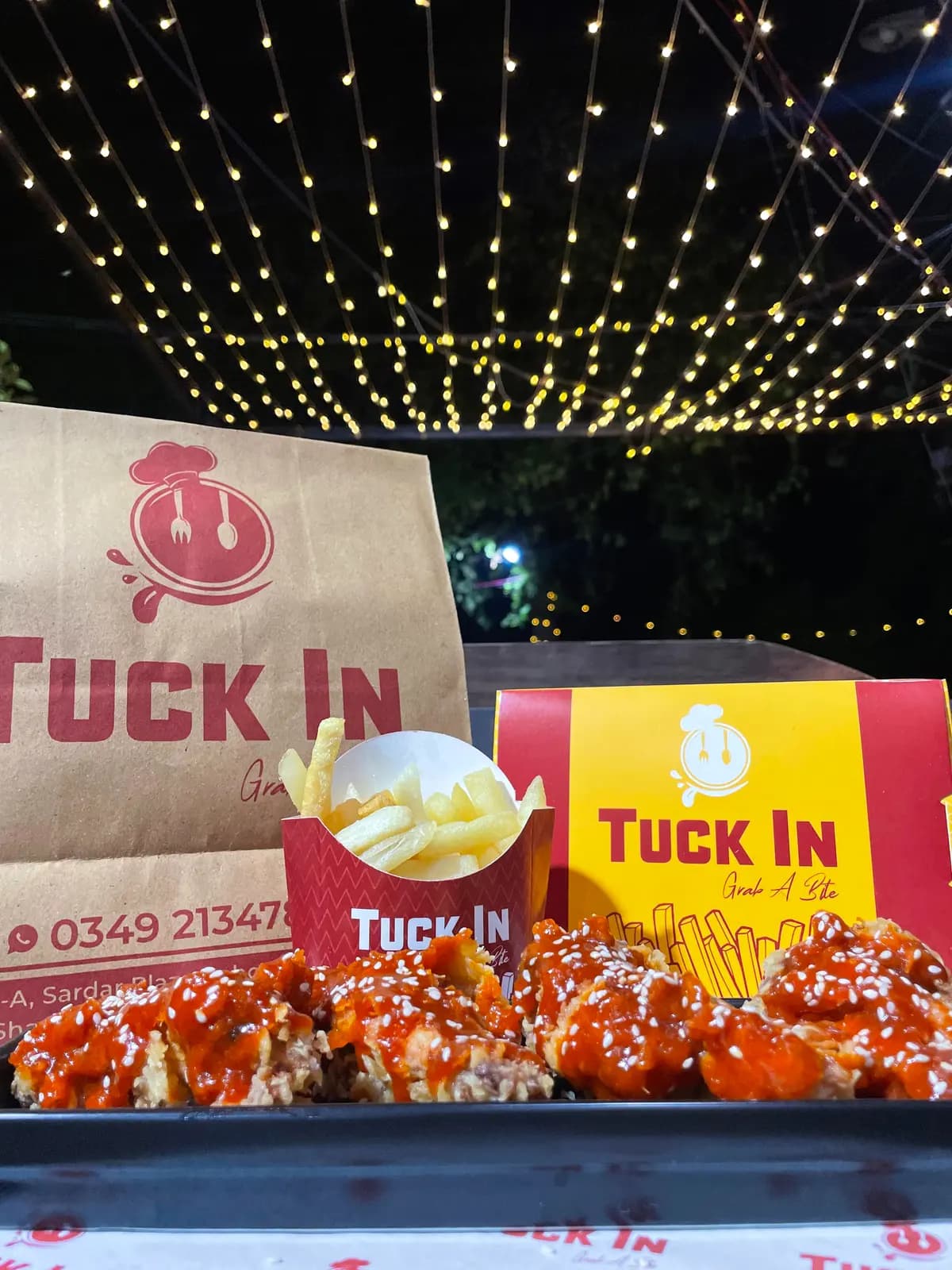 Tuck In under the lights